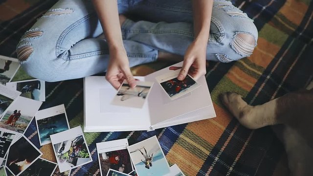 Woman and her dog creating a photoalbum