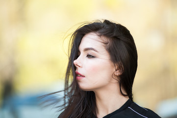 Beautiful smiling young woman wearing black jacket