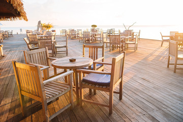 Summer empty outdoor cafe at exotic island on the seashore - obrazy, fototapety, plakaty