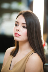 Portrait of beautiful young brunette woman with perfect make up