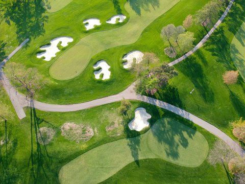 Golf course. Eye bird view from the sky. Aerial photograph of forest and golf course.