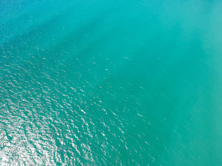 Sea surface aerial view. Bird eye photo of turquoise waves and water surface texture.