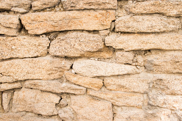 granite stone laid on the wall of the house