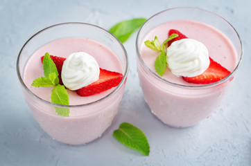 Strawberry panna cotta with mint leaves and fresh strawberries