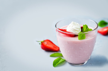 Strawberry panna cotta with mint leaves and fresh strawberries