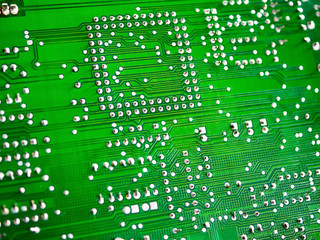 Close-up of printed electronic circuit board with processor and many integrated electrical components. Nanotechnology hardware system. Modern digital science concept. CPU welding or assembled on PCB.