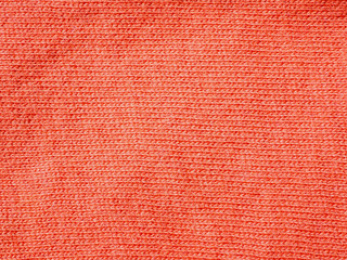 Close-up of the orange red fabric textile texture, background and wallpaper. The texture of orange red fabric textile texture upholstery of furniture. High-quality macro photography.