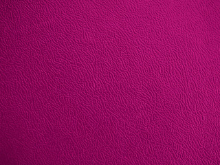 Close-up of purple woven fabric leather plastic textile lattice or grid surface texture. Crossover lines. A lattice work of interwoven purple plastic textile textured strips forms a pattern background