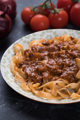 Italian ragu bolognese with flat fettuccine pasta