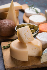 Aged cheese round and slices