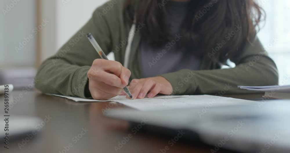 Poster Woman write on the note at home