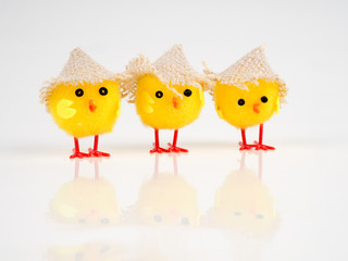 little baby toy chicken on a white background, a lot of chickens, the concept for Easter