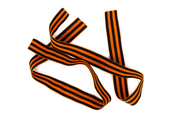 St. George ribbon on a white background. Black orange ribbon close up on a white background.