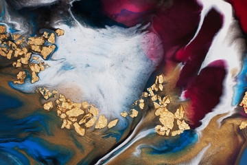 Resin art. Abstract painting. Acrylic pouring with the addition of gold foil.