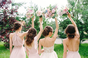 Bridesmaids Holding Wedding Bouquets Outdoor Happy Wedding Concept