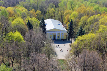 Panoramic view from above on Izmailovsky Park in Moscow Russia with gentle green trees, architecture and the horizon against the clear sky