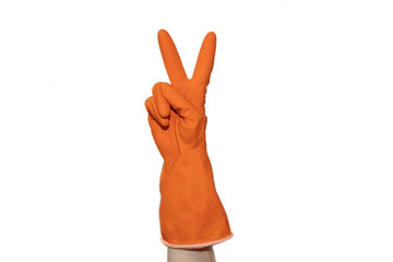 Orange rubber glove on hand isolated on white background. Clean hands when cleaning. Isolated object. Body parts. Cleaning.