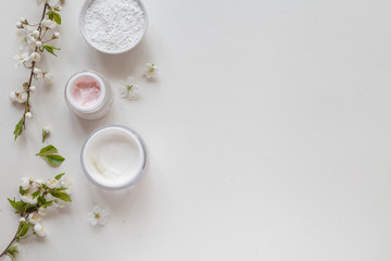 White background with organic cosmetics with natural ingredients. Top view.