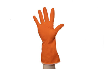 Orange rubber glove on hand isolated on white background. Clean hands when cleaning. Isolated object. Body parts. Cleaning.