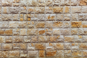 Ocher colored stones background