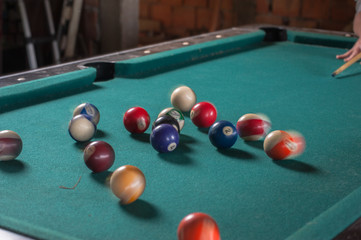 Billiards balls and cue on billiards table. Billiard sport concept