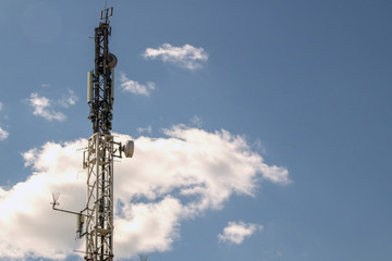 Mobile phone communication antenna tower with the blue sky and clouds, Telecommunication tower