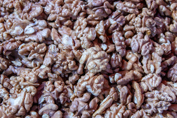 Close up of peeled walnuts – texture or background