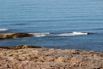Beautiful aerial view on sea surface and rocky coast