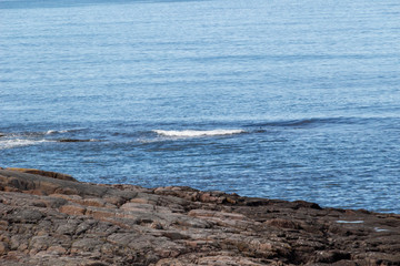 Beautiful aerial view on sea surface and rocky coast