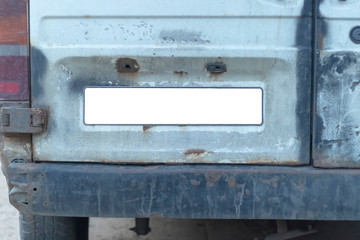 Close-up Of A Empty White Number Plate On dirty Car, copy space