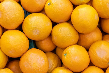 Mandarin, tangerines in the market as a background close-up