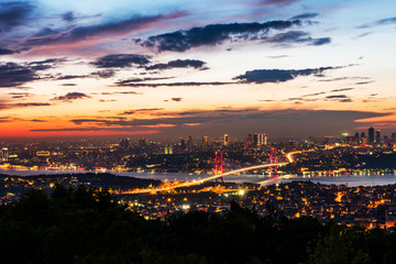 Istanbul Bosphorus Bridge at sunset. 15th July Martyrs Bridge. Night view from Camlica Hill. Istanbul, Turkey..