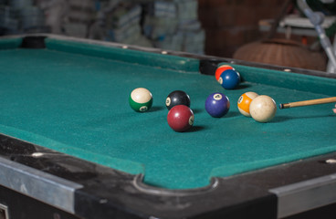 Billiards balls and cue on billiards table. Billiard sport concept