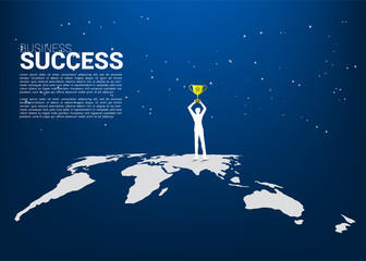 Silhouette of businessman with champion trophy standing on world map. Business Concept of international award winner.