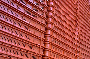 Many red plastic storage boxes. Seamless pattern.