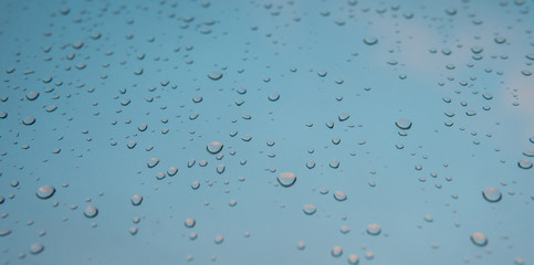 raindrops on the glass macro photo. Texture of the water raindrops