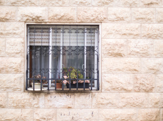 Fototapeta na wymiar old window on wall of stone 