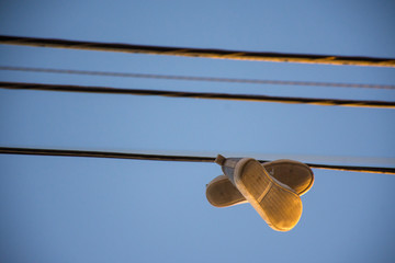 shoes hanging from a wire