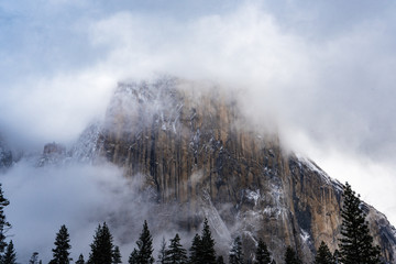 snowy El Capitan in clouds