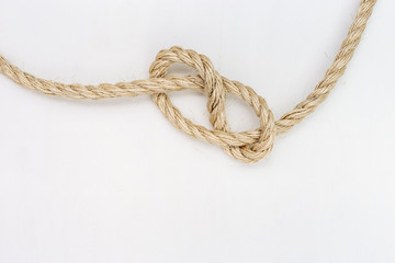 Rope knot on white background. Copy space.
