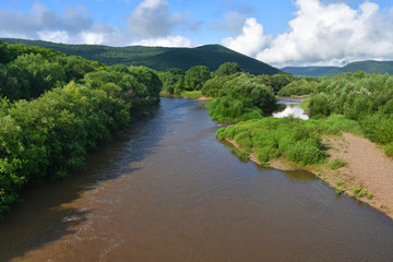 Obraz premium Russia, Primorsky Krai, river Arsenievka (Arsenyevka) in cloudy day