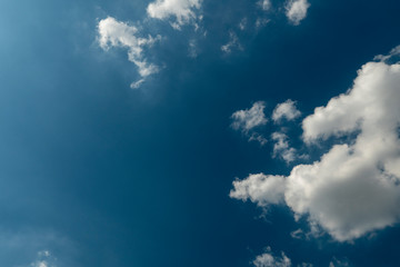 Fototapeta premium Beautiful blue sky with patchy white cloud on tropical weather in summer time background pattern. Skyscape background