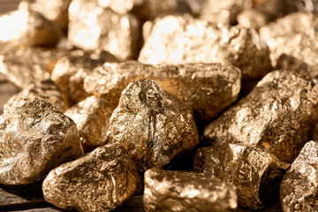 close up view of gold textured stones shining in sunlight