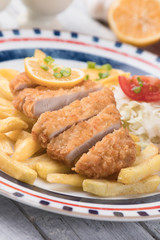 Breaded cutlet with french fries