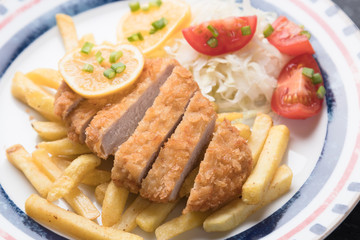 Breaded cutlet with french fries