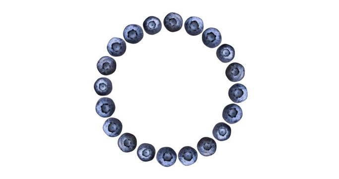 Round frame of blueberries on white background