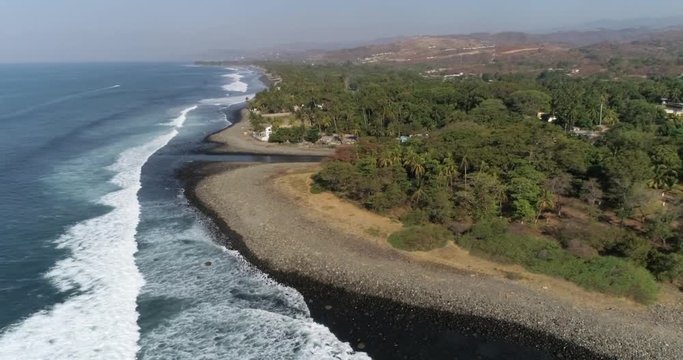 Tropical beach with palm trees great for travel and leisure commercials. Green lush slow motion palm trees. Airflow Creations tourism best clips.
