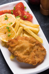 Breaded cutlet with french fries