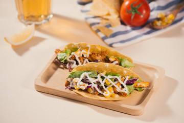 Traditional mexican taco with meat and vegetables. Latin american food.