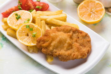 Breaded cutlet with french fries